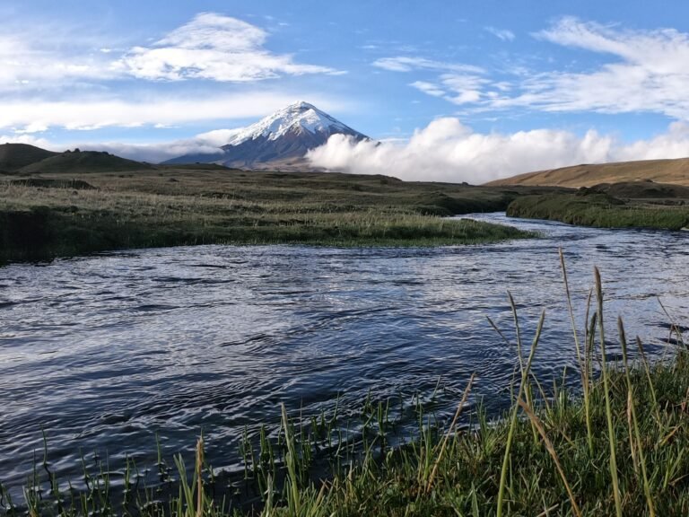 Cotopaxi volcano view from Cotopaxi National Park with river and highland landscape