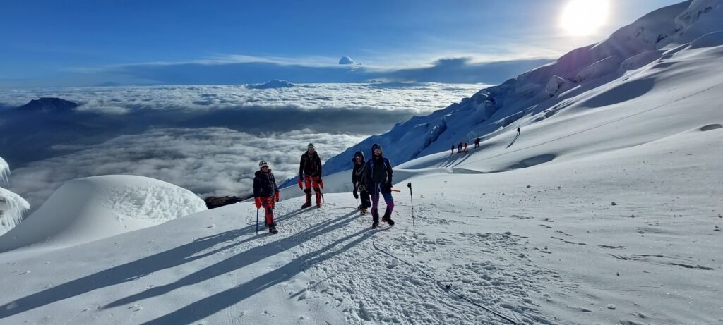 Guided climbers ascending the Cotopaxi glacier during a summit climb