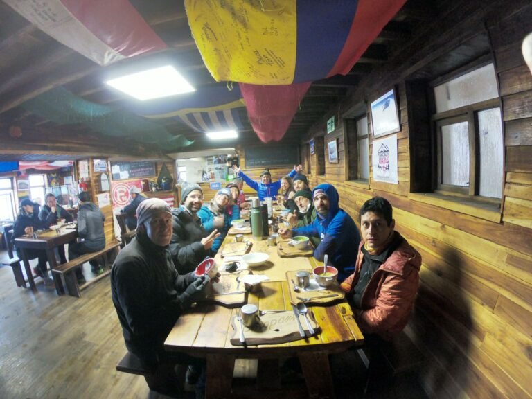 Mountaineers resting and having dinner at Cotopaxi mountain lodge